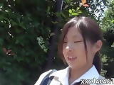 Nerdy Japanese schoolgirl with glasses teases in public